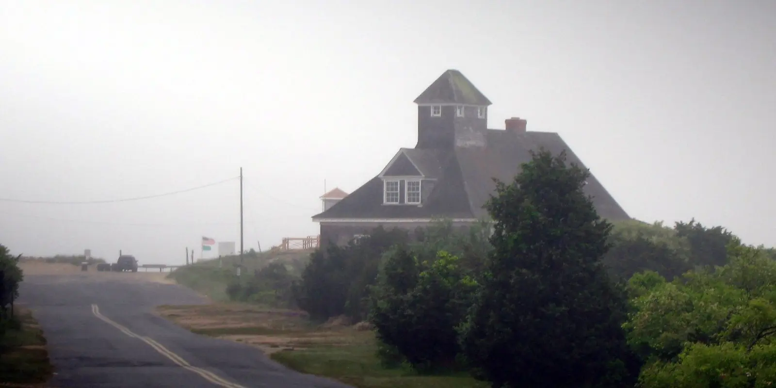 The Coast Guard station at Atlantic Avenue Beach, Amagansett, a shingled building among dunes and pines